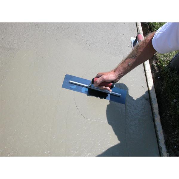 Marshalltown Blue Steel Finishing Trowel with Curved DuraSoft® Handle being used to smooth concrete