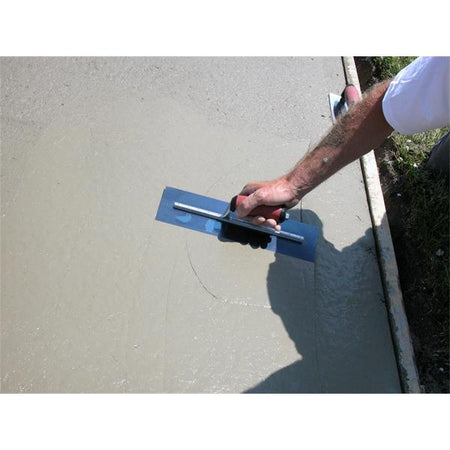 Marshalltown Blue Steel Finishing Trowel with Curved DuraSoft® Handle being used to smooth concrete