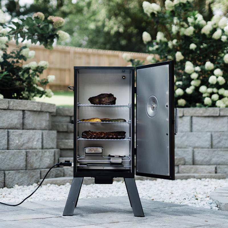 Masterbuilt Analog Wood Chips Vertical Smoker MB20070210 with door open full of food