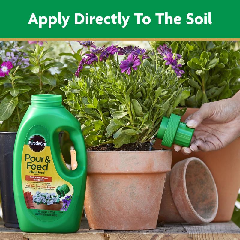 Miracle-Gro Pour & Feed Plant Food being applied directly to soil