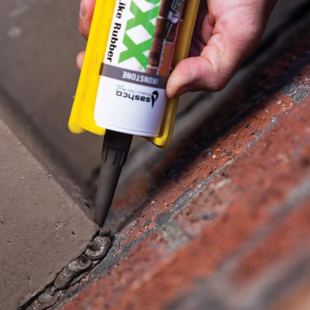 Sashco 10.5 Oz Mor-Flexx Mortar & Stucco Repair Sealant being applied on a mortar crack.