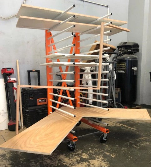 Wooden boards shown on the PaintLine PDREX in a workshop setting with tools and equipment in the background.