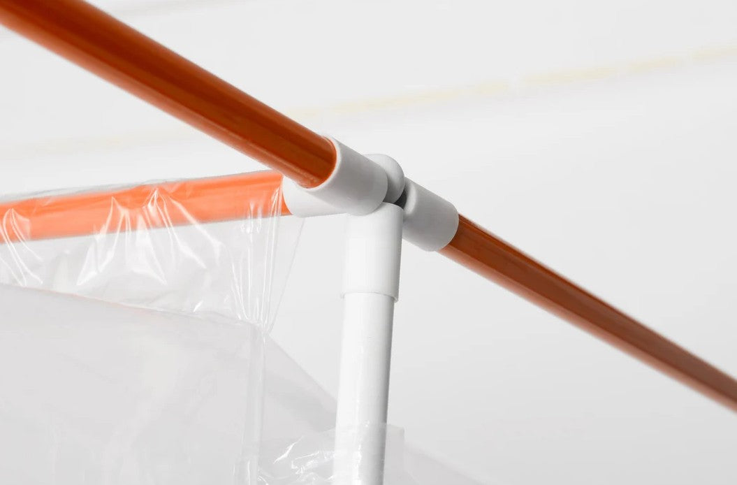 Close-up of the PaintLine PJSB Jobsite Spray Booth with orange trim and a brown pole on a white background