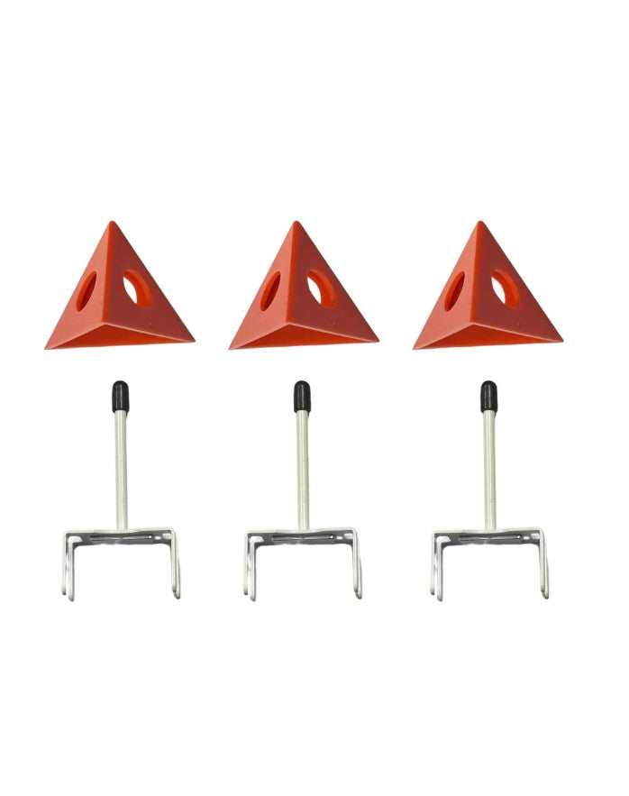 Three red triangular signs with metal stands on a white background