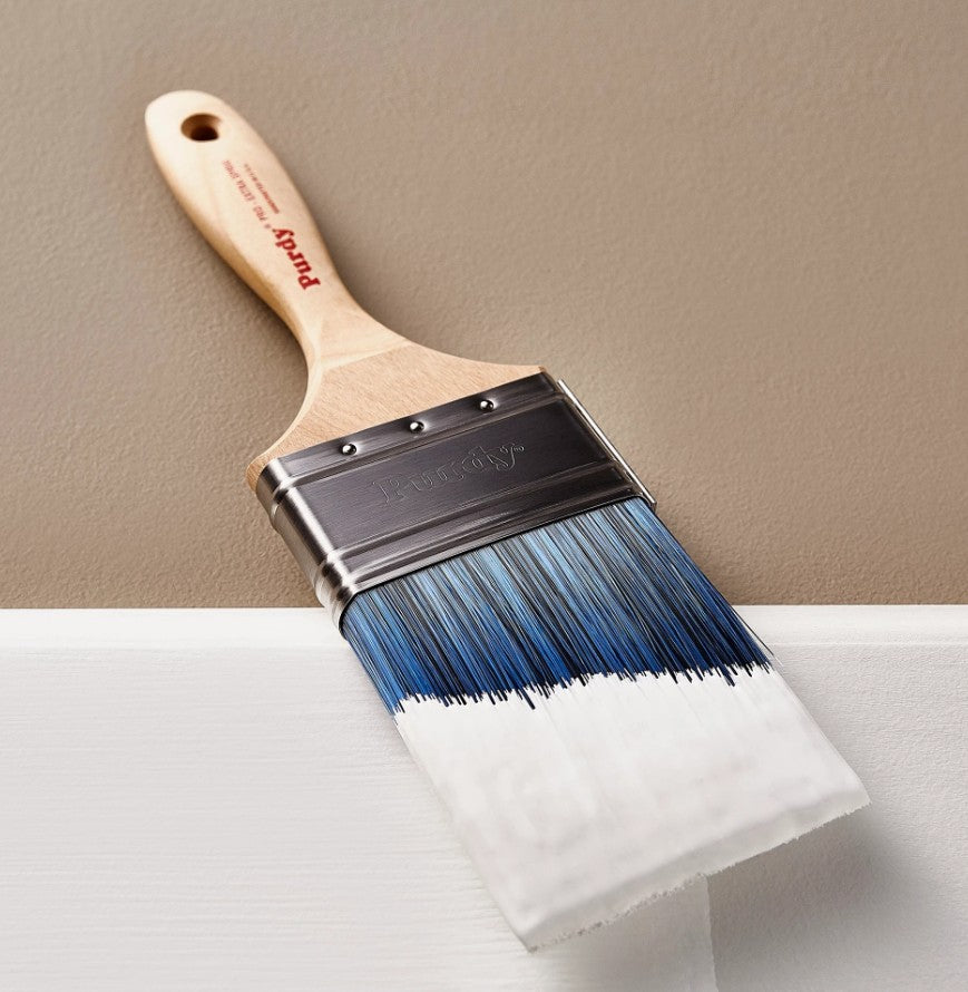 Purdy Pro Extra Sprig Paint brush dipped in white paint.
