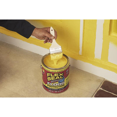 FLEX SEAL Flex Seal Flood Protection Starter Kit being applied around baseboards with a paint brush.