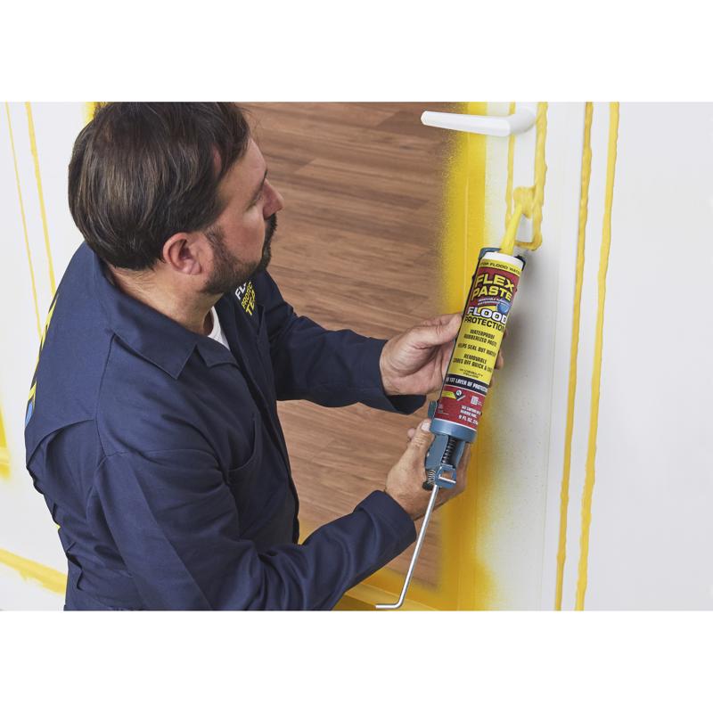 Flex Seal Flood Protection Waterproof Rubberized Paste 9 Oz Cartridge RPSYELR10 being applied around a door lock.