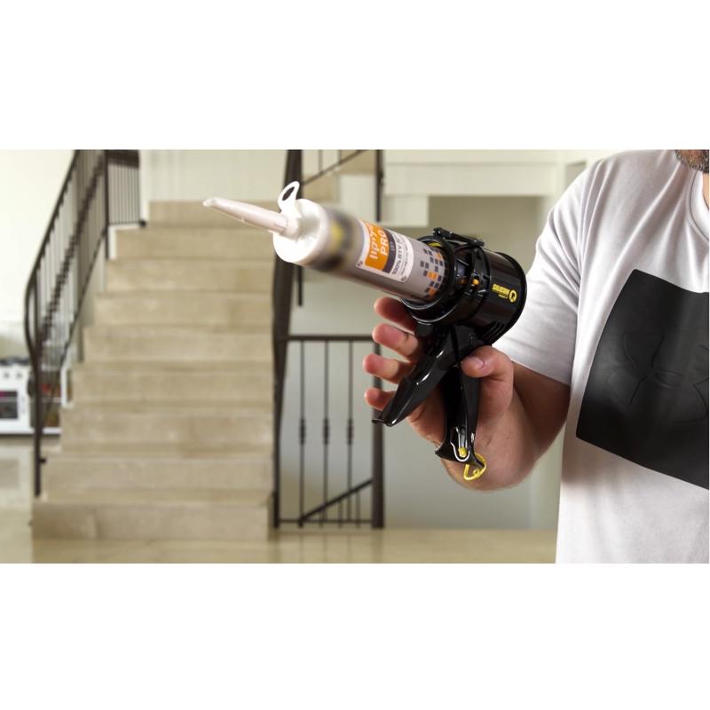 SILIGUN Professional Plastic Drip Free Caulking Gun being held in a hand.