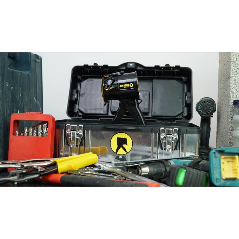 SILIGUN Professional Plastic Drip Free Caulking Gun shown on top of a toolbox.