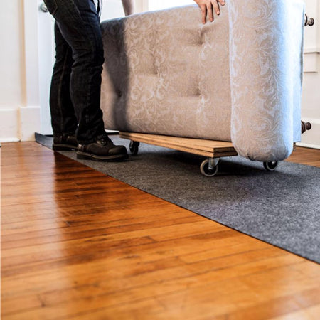 Surface Shields Pro Shield Surface Protector on a floor with furniture on top of it.