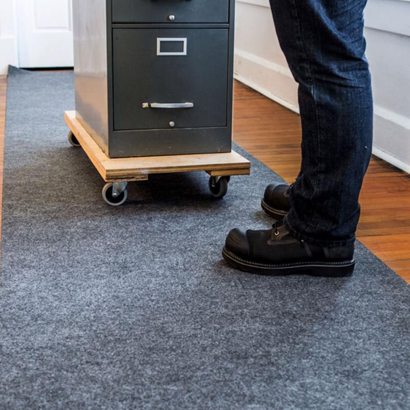 Surface Shields Pro Shield Surface Protector on a wood floor protecting it from a filing cabinet being moved.