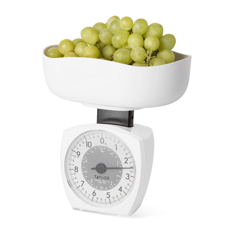 Taylor 3701KL 11 lb Mechanical Kitchen Scale holding grapes