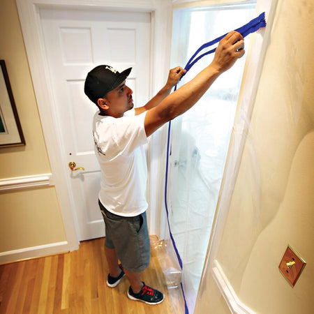 Trimaco E-Z Up Dust Containment Door Kit being applied to a doorway.