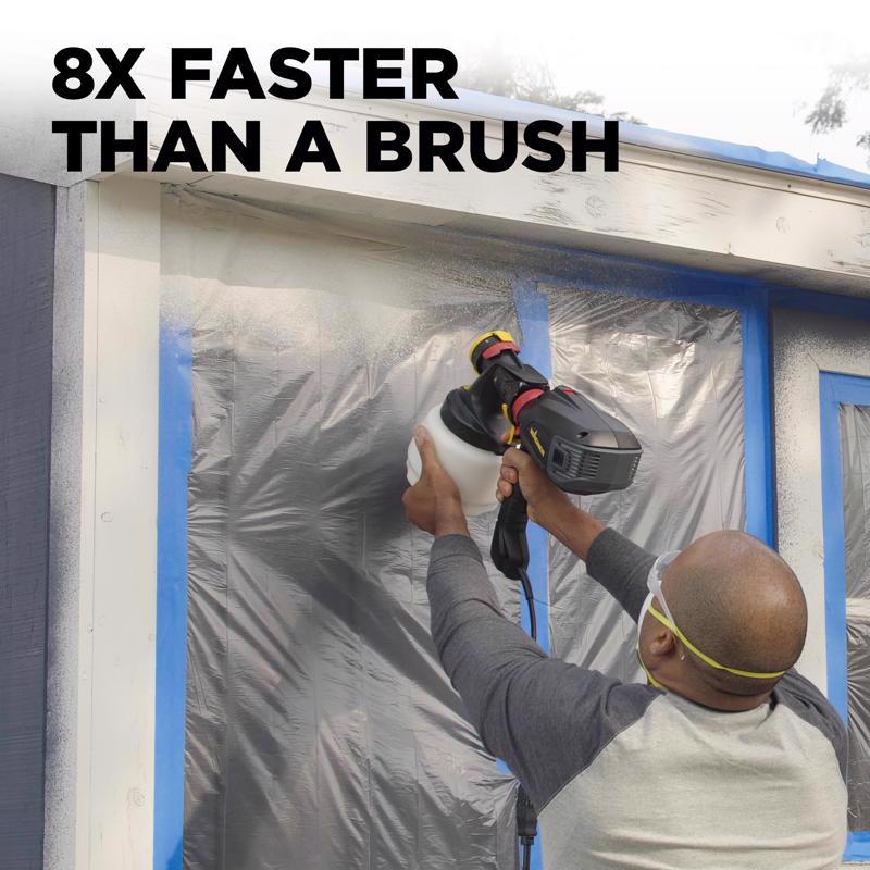 Man spraying exterior trim on a house using the Wagner Flexio 575 6 PSI Metal HVLP Paint Sprayer 2419305.