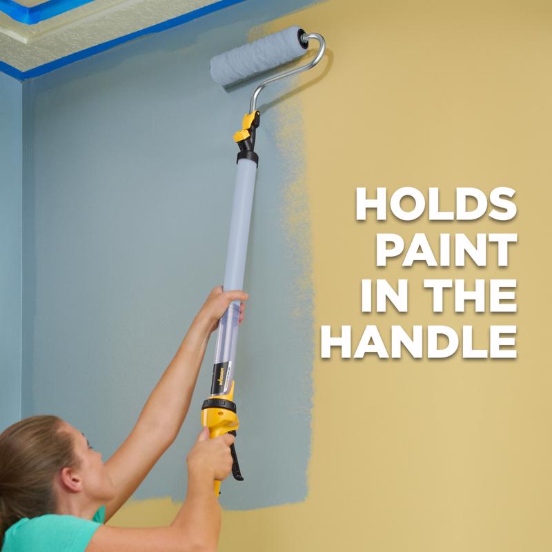 Woman applying paint to a wall using the Wagner E Z Roller 9 in. W Regular Paint Roller Kit.