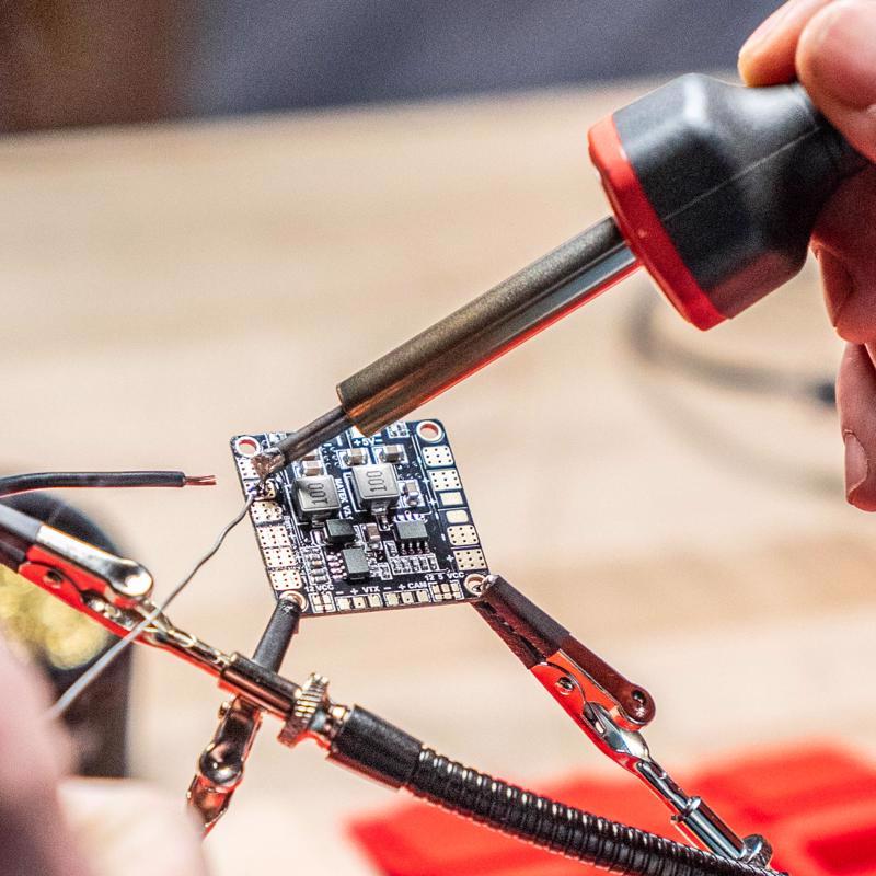 Weller Corded Soldering Iron Kit being used to solder a circuit board.