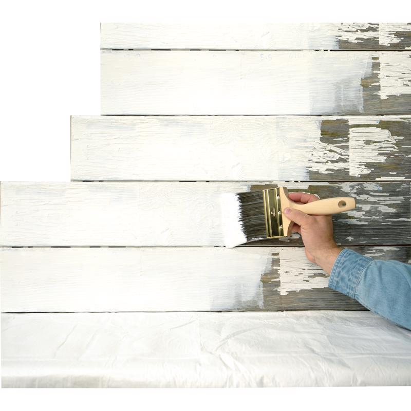 Hand painting a wooden surface with a brush with Zinsser Peel Stop Triple Thick.