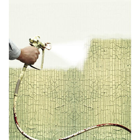 Person using a paint sprayer to apply Zinsser Peel Stop Triple Thick on a textured wall